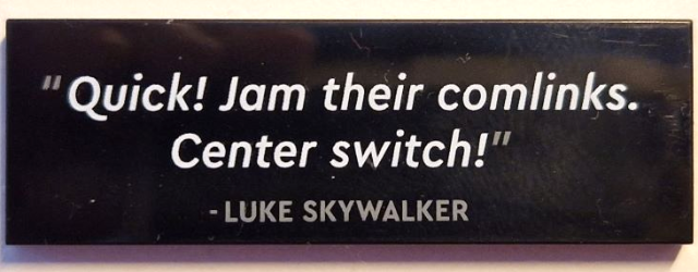 Black Tile 2 x 6 with '"Quick! Jam their comlinks. Center switch!" - LUKE SKYWALKER' Pattern