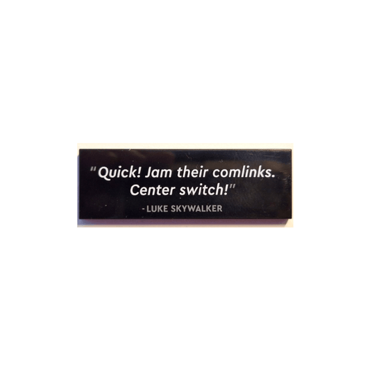 Black Tile 2 x 6 with '"Quick! Jam their comlinks. Center switch!" - LUKE SKYWALKER' Pattern